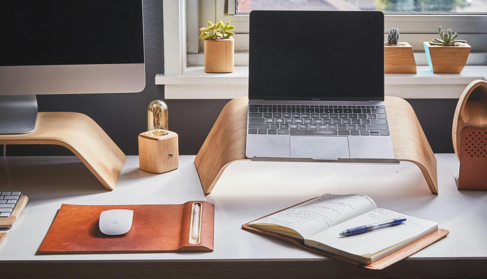 Free A stylish and contemporary home office setup with laptop and desk accessories. Stock Photo