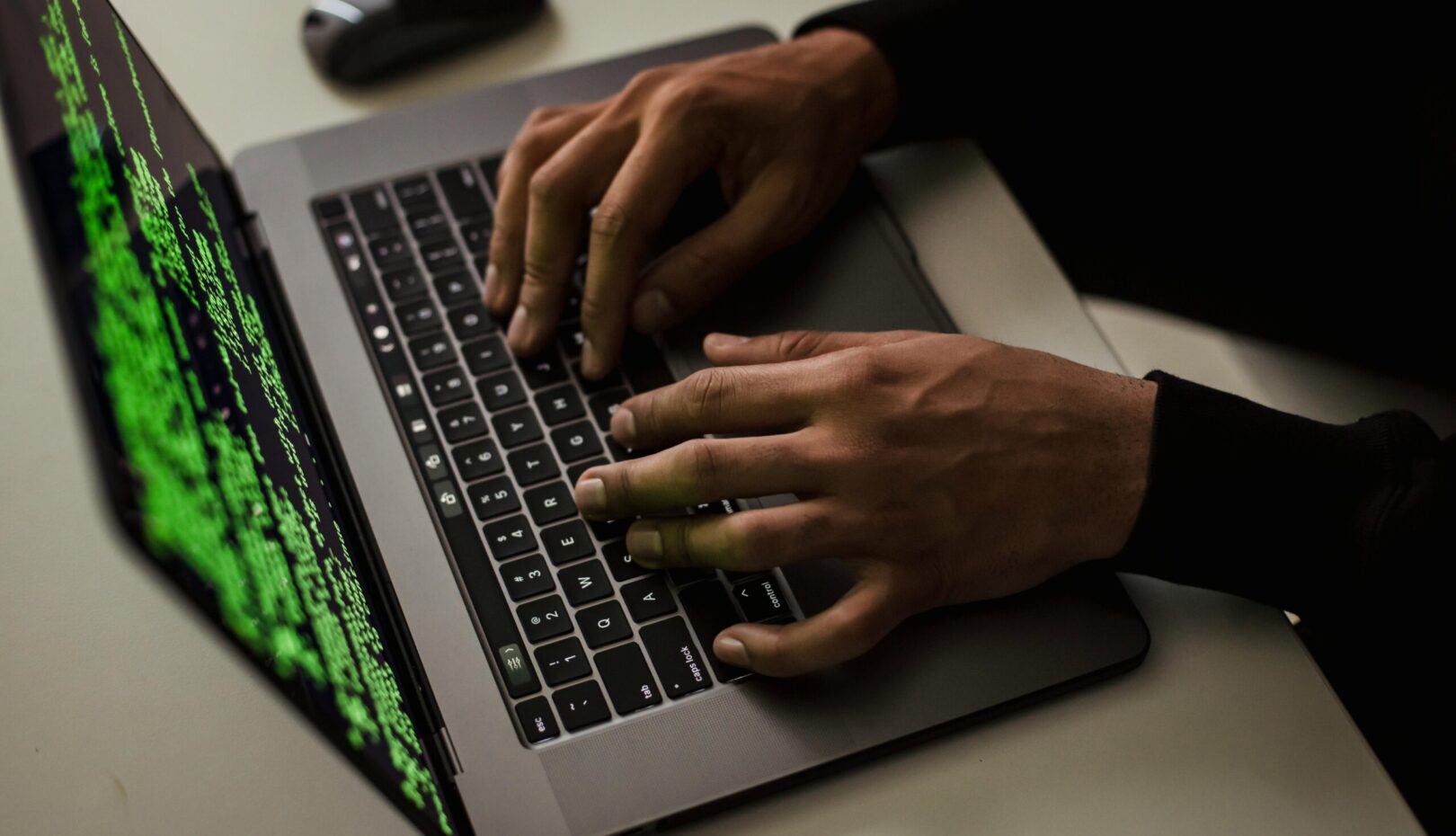 crop-cyber-spy-hacking-system-while-typing-on-laptop