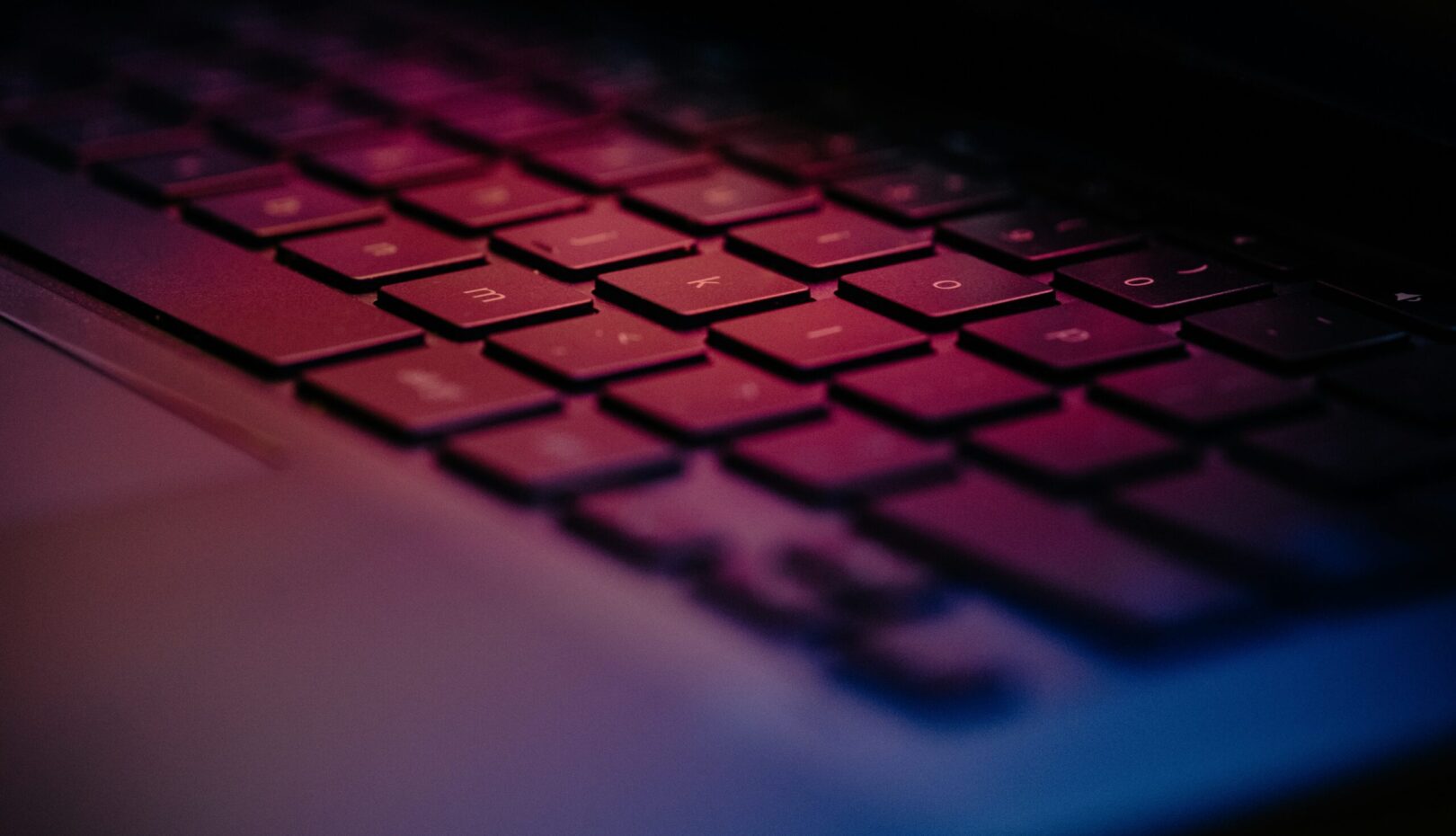 a-close-up-of-a-keyboard-with-a-blurry-background