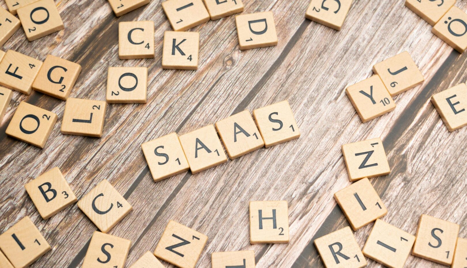 scrabble-letters-spelling-saas-on-a-wooden-tabl